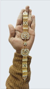 Gold-Plated Traditional Saree Pallu Brooch with Floral Motif & Stone Work